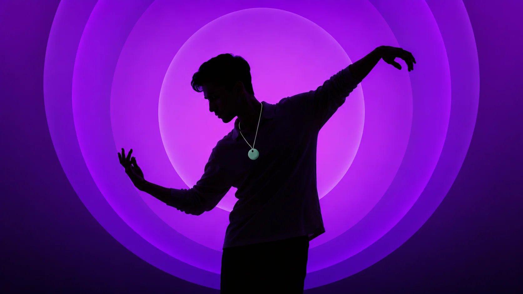 Aura pendant against a dark backdrop